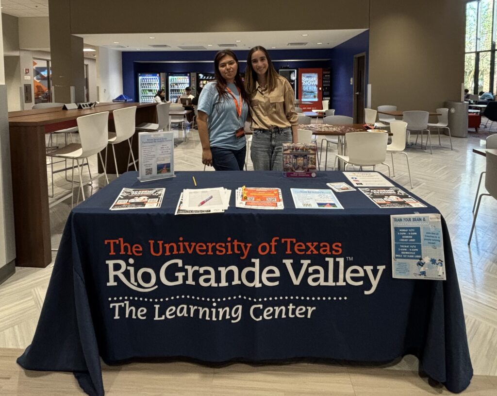 The Learning Center peer coaches Valeria Guadarrama Chavez and Corina Garcia pose in front of a table at the Train Your Brain & Create Collaboratively event Tuesday at the Music, Science, and Learning Center building on the Brownsville campus. 
Jasmine Espinsoa/Vaquero Radio.